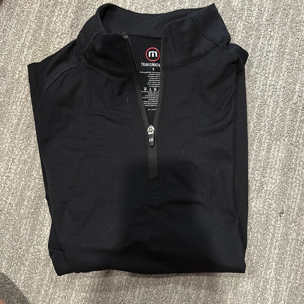 Travis Matthew’s half zip men’s golf jacket